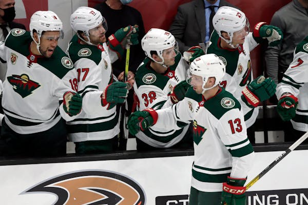 Wild center Nick Bonino (13, being congratulated by teammates after a goal against the Ducks in January) was one of three Wild players released from C