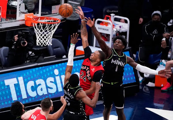 Raptors guard Norman Powell shot the ball as Timberwolves guard Malik Beasley defended during the second quarter of Friday night’s game.