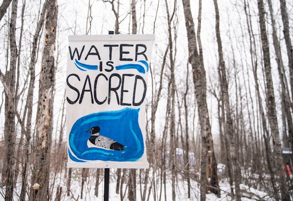 Signs are posted outside Camp Migizi, a small encampment of mostly indigenous water and land protectors located right beside the Enbridge Line 3 const