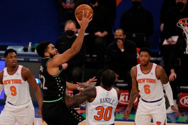 Wolves star Karl-Anthony Towns put up a shot against the Knicks on Sunday night in New York.