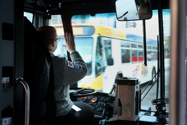 Metro Bus driver Deb Sievers heads along her route in downtown Minneapolis and Uptown.