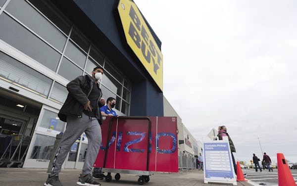 Shoppers leave a Best Buy store on Black Friday, in Wilkes-Barre, Pa., Friday Nov. 27, 2020. (Mark Moran/The Citizens&#39; Voice via AP)