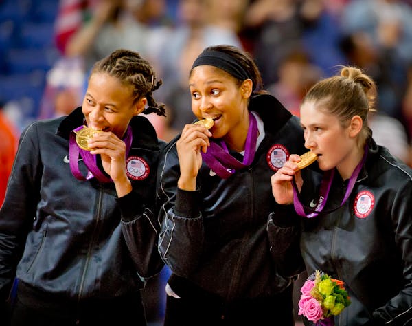 Lynx teammates Seimone Augustus, Maya Moore and Lindsay Whalen posed for photographers after winning Olympic gold medals in London in 2012.