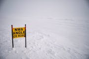 A sign marking the Northwest Angle Ice Road sat on the side of the road on Lake of the Woods on February 9, 2021. 