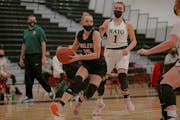 Eden Prairie eighth-grader Tori Schlagel (15) drives to the basket as Rochester Mayo’s Hannah Hanson (1) looks on. Schlagel scored a career-high 14 