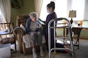 Brenna White, a nurse with Ridgeview Medical Center, prepared to vaccinate Lois Gatz, 90, with a dose of the Pfizer-BioNTech COVID-19 vaccine, in Gatz