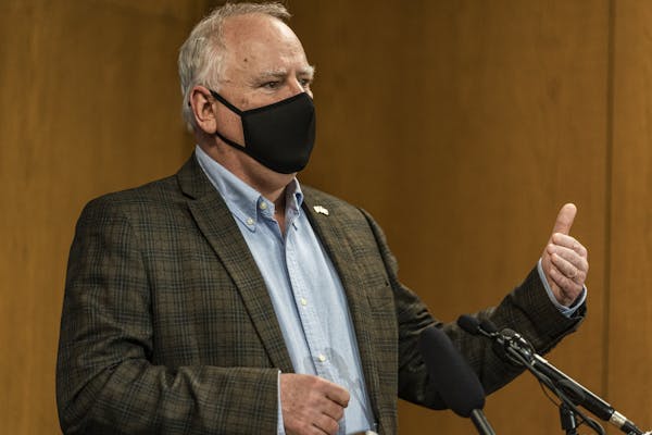 Gov. Tim Walz is going to quarantine through March 25 because a member of his staff tested positive for COVID-19 on Wednesday.   ] RICHARD TSONG-TAATA