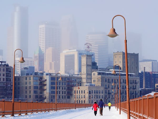 The Minneapolis skyline was locked in an hazy shroud in February 2021, as seen from the Stone Arch Bridge. 