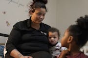 Keyana Johnson was 21 years old and pregnant when she “aged out” of the foster care system. Here, Johnson started her day with her children Stepho