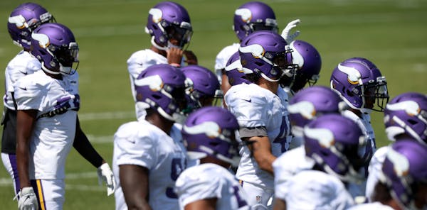 Minnesota Vikings players warmed up before the start of practice.