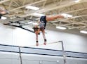 Perham/New York Mills’ Jada Olsen competes on the uneven bars in the Class 1A State Gymnastics meet at Champlin Park High School on Friday, March 26