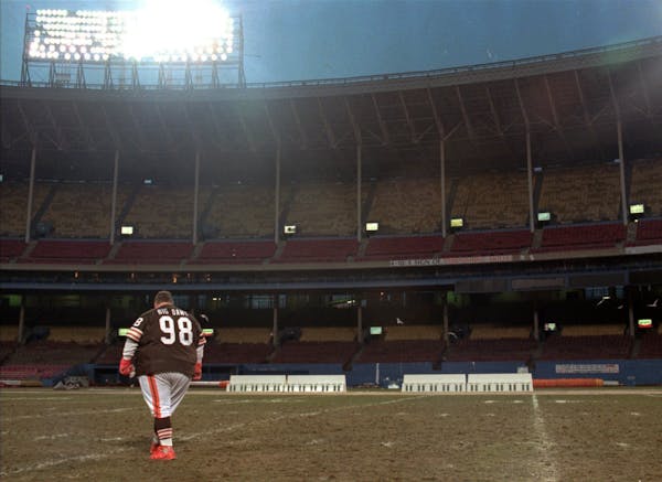 Browns super fan “Big Dawg,” aka John Thompson, walked across the deserted field at Cleveland Stadium after the Browns’ 26-10 victory over the C