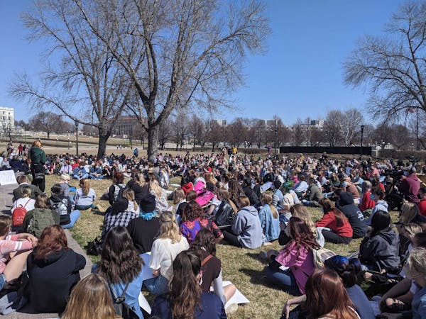 More than 100 people gathered in front of the Minnesota Capitol on Monday, March 29, 2021 to call on legislators to pass stronger sexual assault laws.