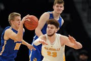 Forward Jamison Battle (23), playing for DeLaSalle against Waseca in the 2019 state tournament, committed to the Gophers through the transfer portal f