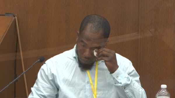 In this image from video, witness Donald Williams wipes his eyes as he answers questions, as Hennepin County Judge Peter Cahill presides Tuesday, Mar