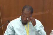 In this image from video, witness Donald Williams wiped his eyes as he answered questions during the trial of former Minneapolis police officer Derek 