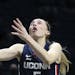 FILE - UConn guard Paige Bueckers (5) shoots against Xavier during the first half of an NCAA college basketball game in Cincinnati, in this Saturday, 