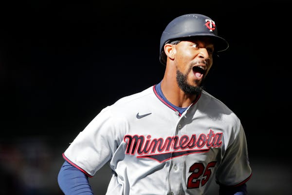Byron Buxton hit a long home run and walked twice in a strong debut.