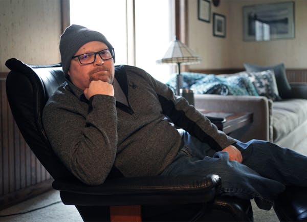 Andy Flosdorf sits in the chair in his home that he has spent most of the last year in. Flosdorf is a COVID Long Hauler. He got COVID in March 2020, a