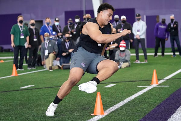 Northwestern offensive lineman Rashawn Slater participates in the school’s Pro Day football workout for NFL scouts on March 9.