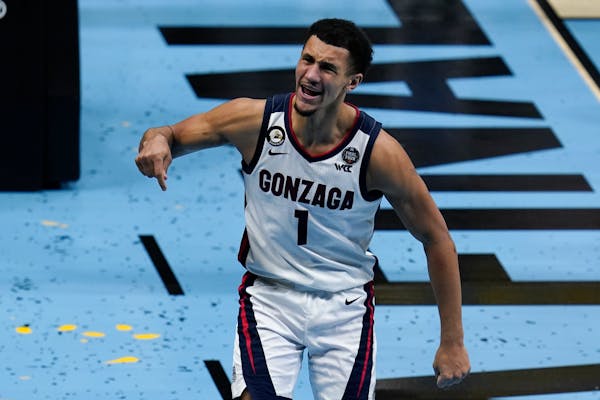 Gonzaga guard Jalen Suggs (1) celebrates after making a basket during the second half of the championship game against Baylor in the men’s Final Fou