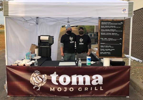 Toma Mojo Grill co-owners Paul Backer, left, and Michael Knox.