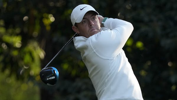 Rory McIlroy of Northern Ireland watches his tee shot on the 11th hole during a practice round for the Masters golf tournament on Tuesday.