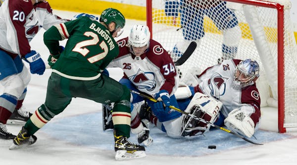 Colorado goalie Philipp Grubauer stops a shot by Nick Bjugstad of the Wild on Monday night. The Wild lost their fifth game in regulation to Colorado 5