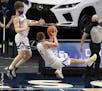 Hayfield’s Easton Fritcher, right, and Isaac Matti, left, hustled for the rebound during the first half of the game, Wednesday, April 7, 2021 at the