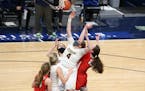 Rosemount’s Helen Staley (4) gains position for a defensive rebound against Centennial Wednesday night. Staley had six rebounds in the first half as