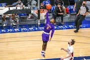 Cretin-Derham Hall’s Tre Holloman (5) goes up for a dunk against Maple Grove Thursday evening. The Raiders led the Crimson 29-16 at halftime of thei