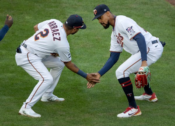 Luis Arraez (2) and Byron Buxton (25) of the Minnesota celebrated at the end of the game.