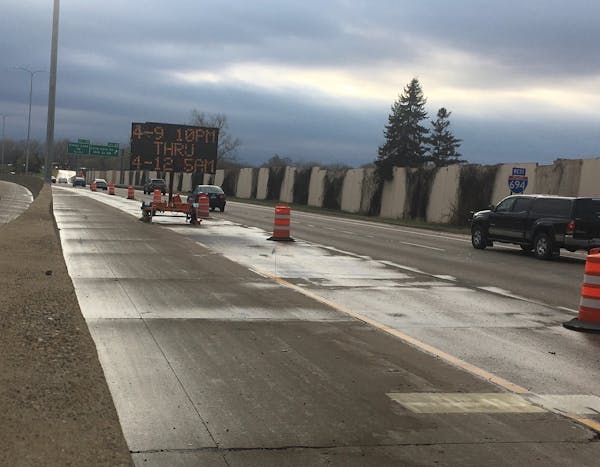 Signs warn drivers that westbound I-694 in New Brighton will be closed this weekend.