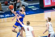 Hayfield�s Ethan Slaathaug goes up for a layup in the first half of the Class 1A championship Saturday afternoon. Photo by Earl J. Ebensteiner, Spor