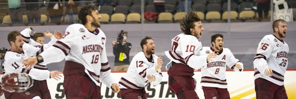 University of Massachusetts men’s hockey players rushed onto the ice to celebrate after defeating St. Cloud State 5-0 Saturday to claim the program�