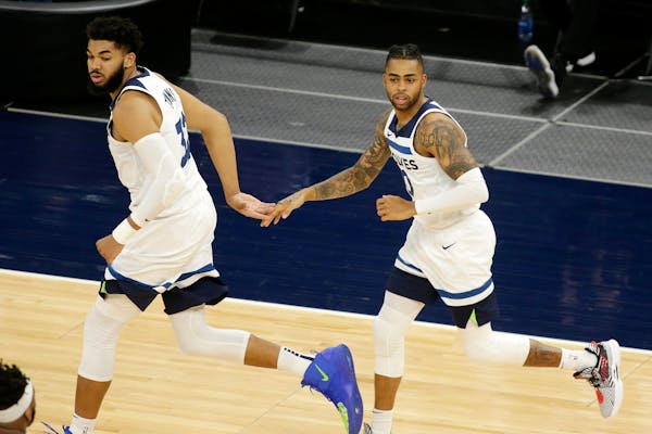Karl-Anthony Towns and D’Angelo Russell celebrated a basket against the Bulls during Sunday night’s victory.