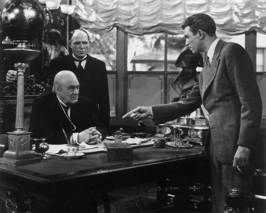 'It's a Wonderful Life' stars James Stewart, right, in this scene with Lionel Barrymore,seated at desk.