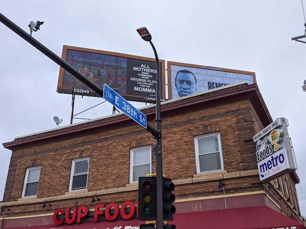 Billboards designed by Jim Denomie and Seitu Jones rise above the corner where George Floyd was killed. Across the street is another, by Xavier Tavera
