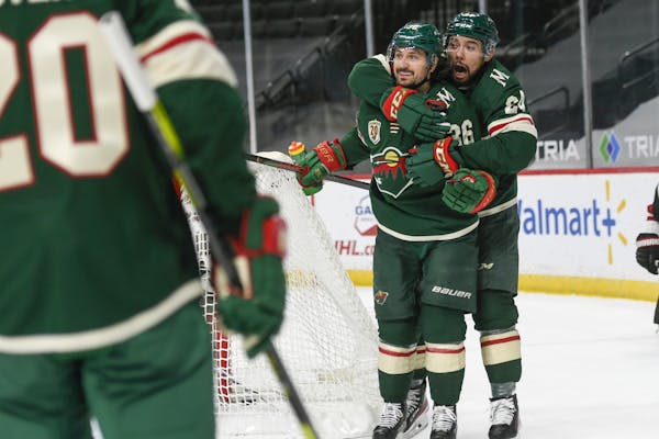 Mats Zuccarello and Matt Dumba, right, celebrated after Zuccarello scored his first goal for the Wild on Wednesday.