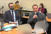 In this image from video, defense attorney Eric Nelson, left, and defendant, former Minneapolis police officer Derek Chauvin address Hennepin County J