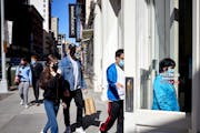 Shoppers entered a Uniqlo store in lower Manhattan on April 13, 2021. Retail sailes surged in March.