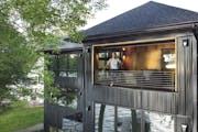 Architect Ali Awad designed this lake home for his family in Burnsville. The three-level home includes a room with a garage door that opens to the lak