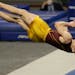 Minnesota’s Shane Wiskus competes in the floor exercise during the NCAA men’s gymnastics championships Friday