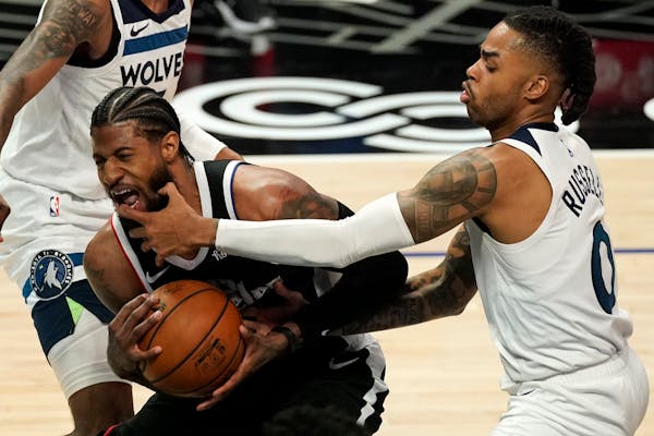 Wolves guard D’Angelo Russell went for the ball and got part of Clippers guard Paul George’s mouth during the first half Sunday.