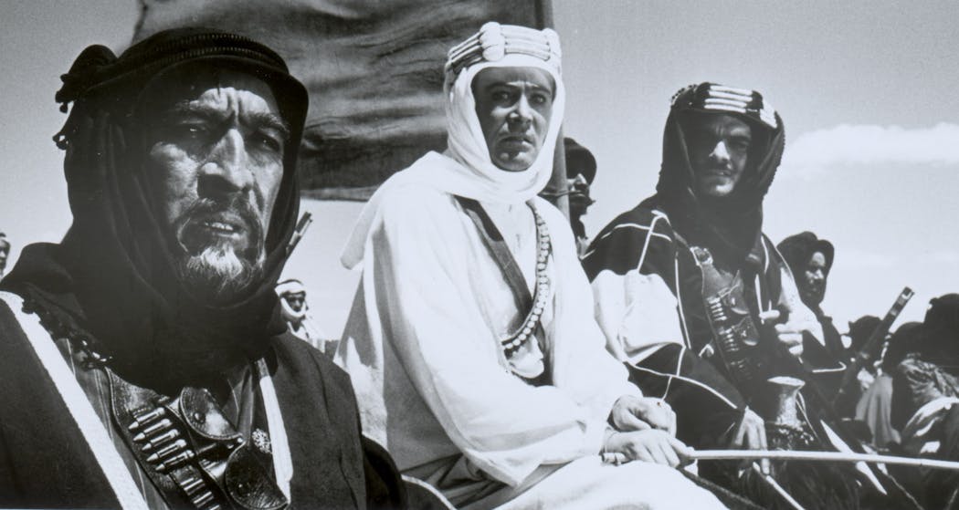 Anthony Quinn (left) stars as Auda abu Tayi, Peter O'Toole (center) as T.E. Lawrence, and Omar Sharif (right) as Sherif Ali ibn Kharish, as they wage war against the Turks, in 'Lawrence of Arabia.'