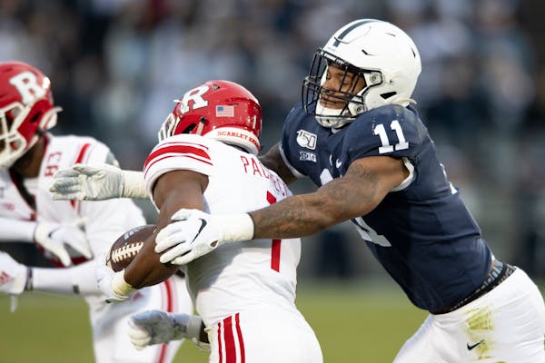 Penn State linebacker Micah Parsons, right, sat out the 2020 season, but is still expected to be a first-round draft pick. 