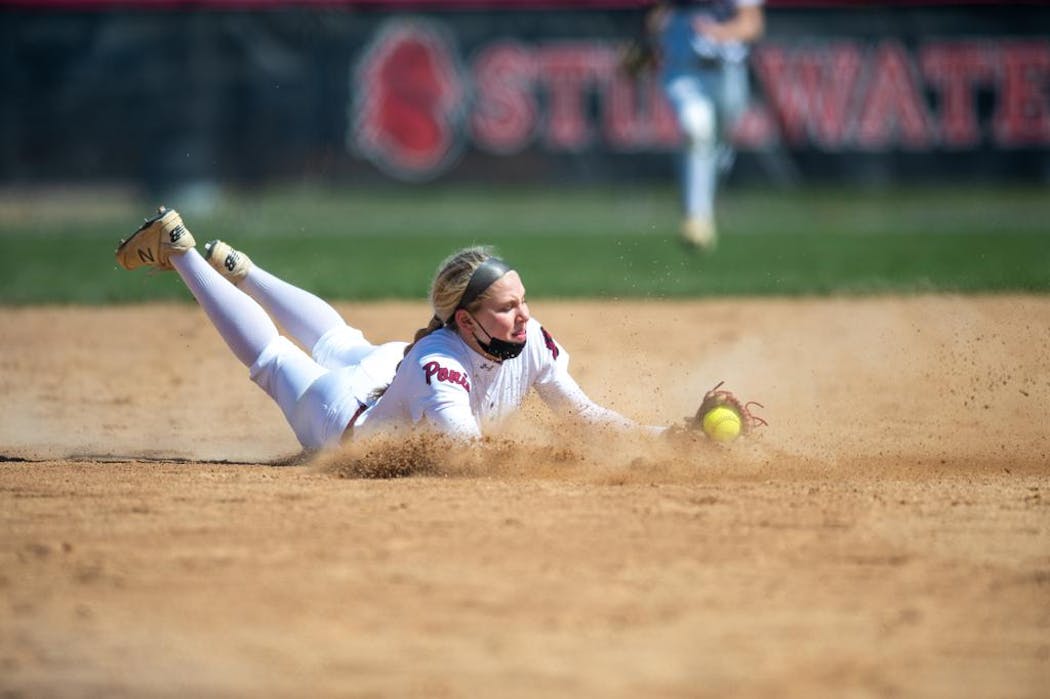 Stillwater shortstop Morgan Wohlers made a diving catch in an April 17 game against Elk River played at Stillwater.