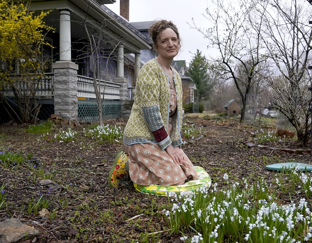 Anne Lippin in her St. Paul front yard garden. For the past few years Lippin has noticed invasive jumping worms in the garden, where they are voracious eaters, particularly of the wood chips that Lippin has used to keep weeds down.