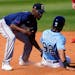 Nick Gordon tagged out a runner during a spring training game.