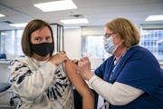 Hennepin Healthcare nurse Christine Runyon administered the Moderna COVID-19 vaccine to Jamie Larson last week at United Labor Center in Minneapolis. 